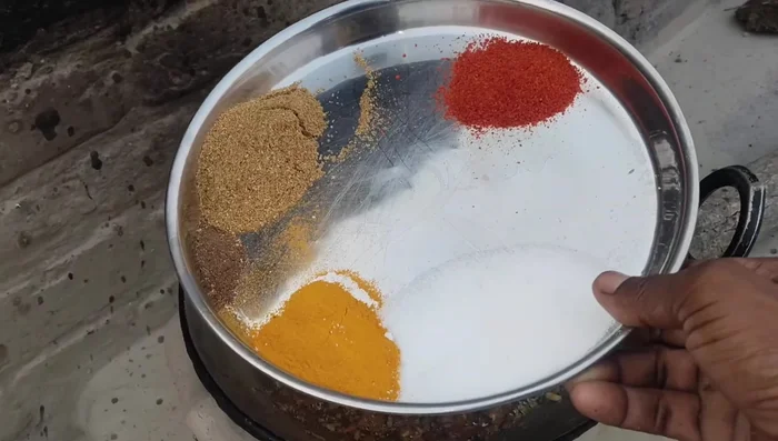 Add dry spices (garam masala, coriander powder, chili powder, turmeric powder, salt) to the roasted masala and mix well.