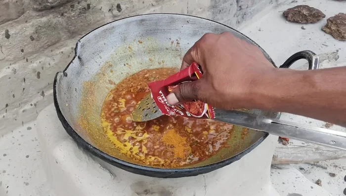Add water and cook the spices until the oil separates and the aroma is fragrant.
