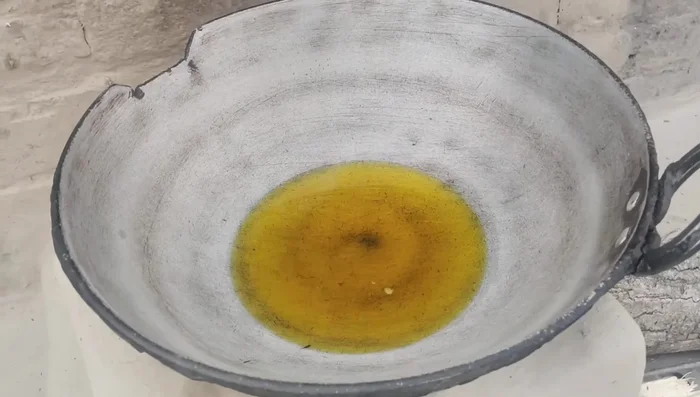 Fry the ground fish lightly in mustard oil. Don't overcook it.