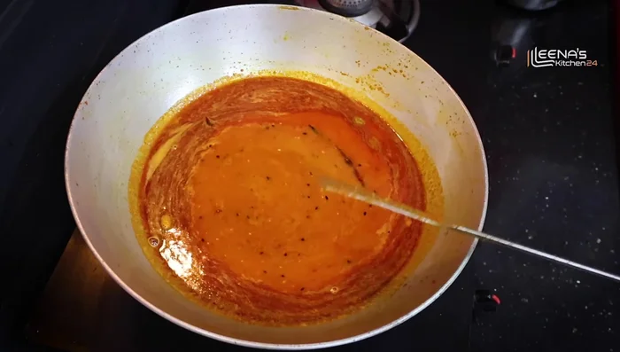 Add water and bring to a boil. Add the fried fish and mix well. Check and adjust salt.