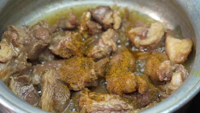 Add cumin powder, coriander powder, turmeric powder, and black pepper powder. Fry for 2-3 minutes.
