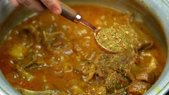 Add prepared kadhai masala and garam masala powder. Fry well until oil separates.