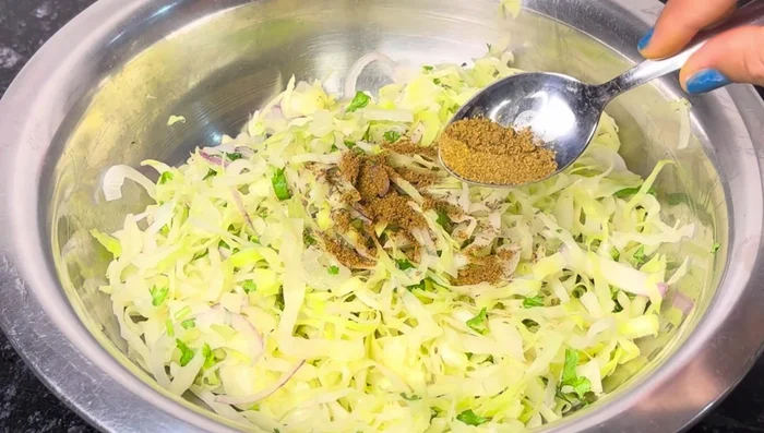 Add celery, garam masala, coriander powder, red chili powder, salt to taste, gram flour, and rice flour (265.84).