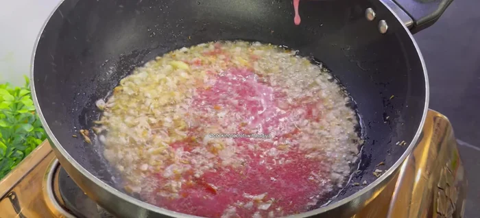 Add tomato paste and fry until the color deepens.