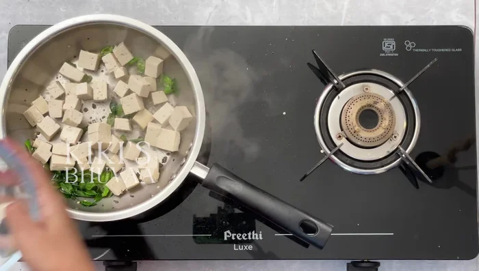 Cook the chickpeas: Heat coconut oil, saute cumin seeds and green chilies, then add chickpeas and fry until golden brown.