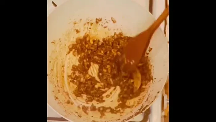 Reduce heat to low. Add 1 teaspoon coriander powder, 1 teaspoon cumin powder, ½ teaspoon turmeric powder, and 1 teaspoon chili powder. Sauté for 10-15 seconds. (80)