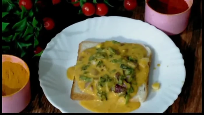 Spread the gram flour batter evenly onto slices of fresh bread (fresh bread works best).