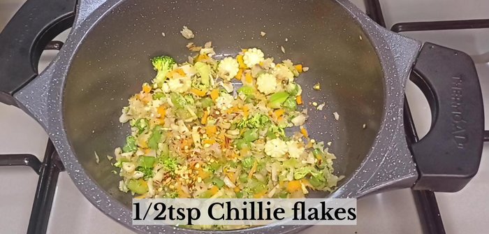 Add ½ teaspoon chili flakes and ½ teaspoon black pepper powder.