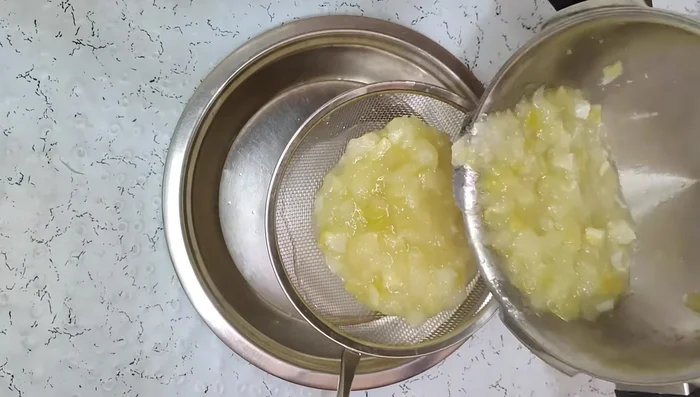 Strain the boiled mangoes to obtain a smooth puree. Set aside.