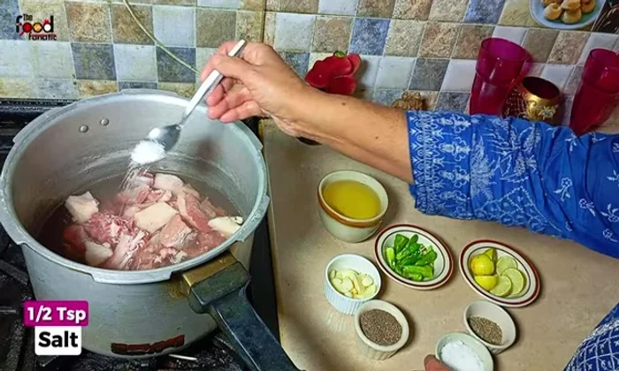 Add 1 teaspoon of salt, 1 teaspoon of whole cumin seeds, and 10-15 peeled garlic cloves.