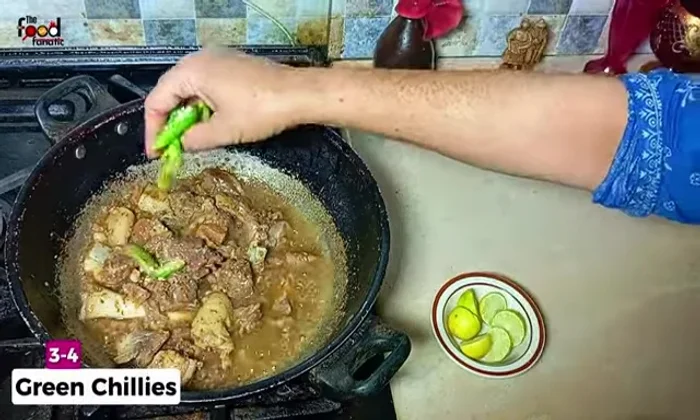 Add 3-4 slit green chilies and fry briefly.