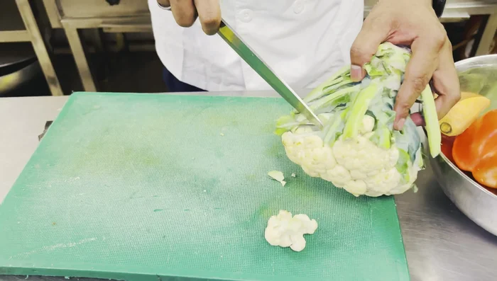 Chop the cauliflower into florets. Separate each floret.