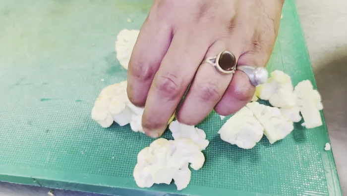 Cut the cauliflower florets into smaller pieces (1/4 or 1/2 depending on size). Inspect carefully for insects.