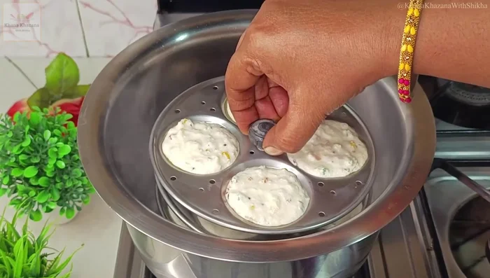 Steam the idlis in a steamer for 15 minutes on high flame.
