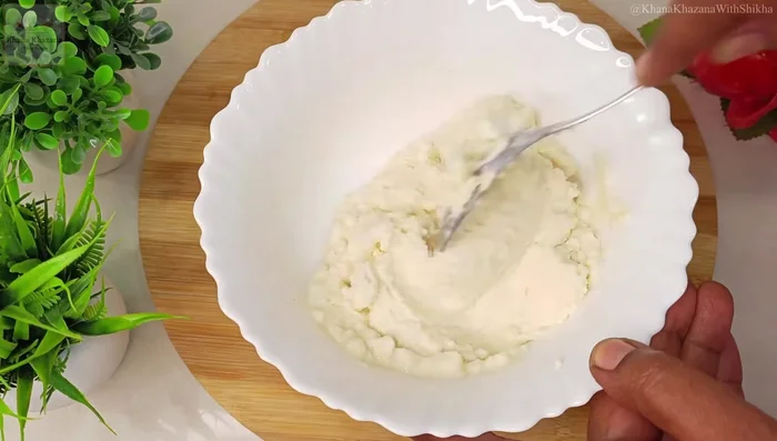 Add water gradually, mixing well to form a thick batter. Beat until smooth and lump-free.