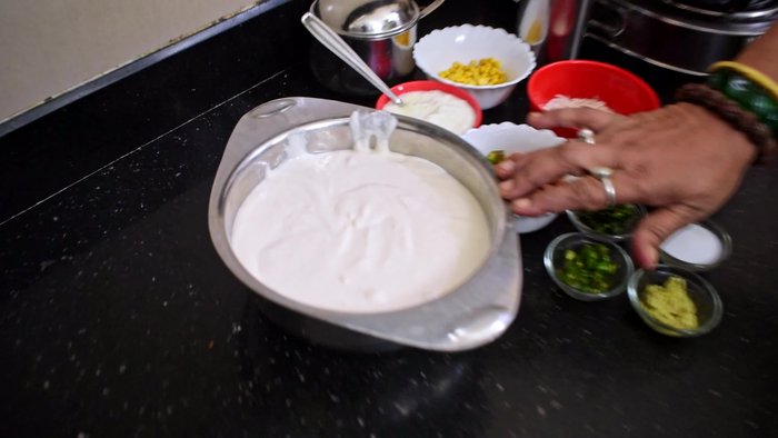 Prepare the Kheer: Heat water. Add spices (ginger, green chilies, neem, red chili powder) to taste.