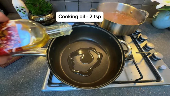 In a separate pan, heat oil and ghee. Sauté chopped vegetables until tender. Add salt to taste.