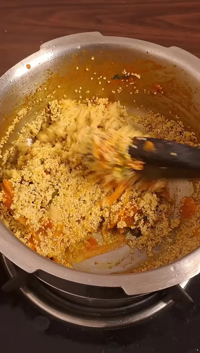 Mix well, close the lid, and cook on high flame for two whistles.