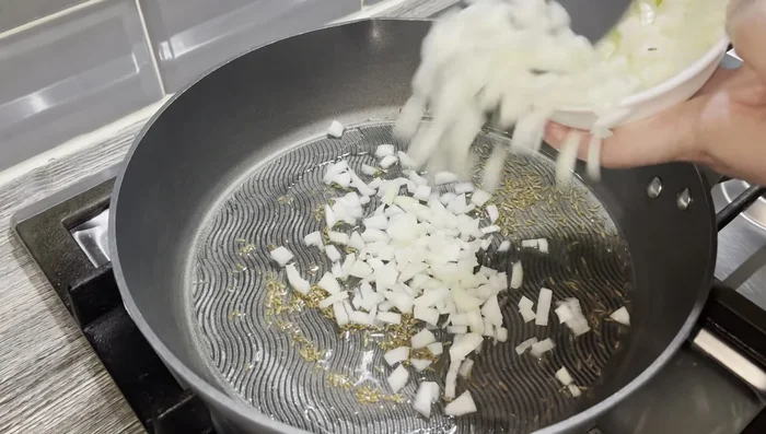 Add 1 medium finely chopped onion and cook until lightly golden brown.
