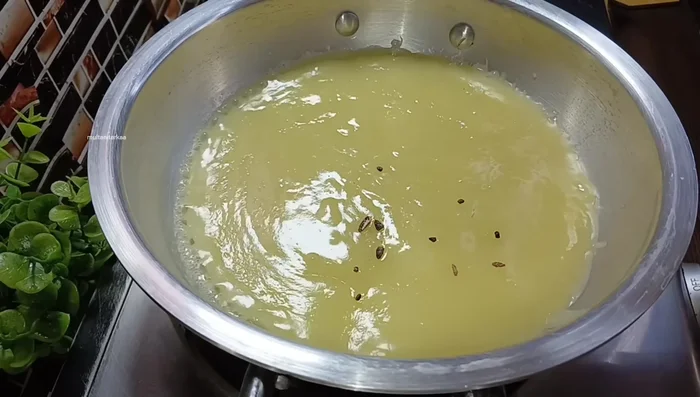 Return the strained puree to the pot. Add sugar and cardamom seeds (optional).