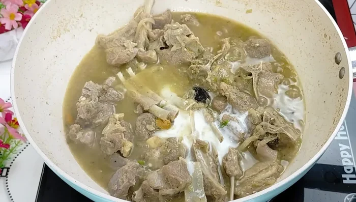 Add curd, mix well, and reduce the flame. Simmer until the curd releases its water and the mutton is well coated.