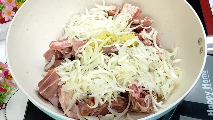 In a pot, combine mutton, chopped onions, black cardamom, green cardamom, cloves, cinnamon, nutmeg flower, salt, and water. Mix well.