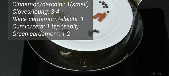 Add whole spices (black pepper, cinnamon, cloves, cardamom, cumin seeds) to the hot oil and fry for a few seconds (114).