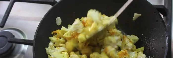 Close the pan and cook over medium heat, stirring occasionally, until the cauliflower is cooked through (no water added).