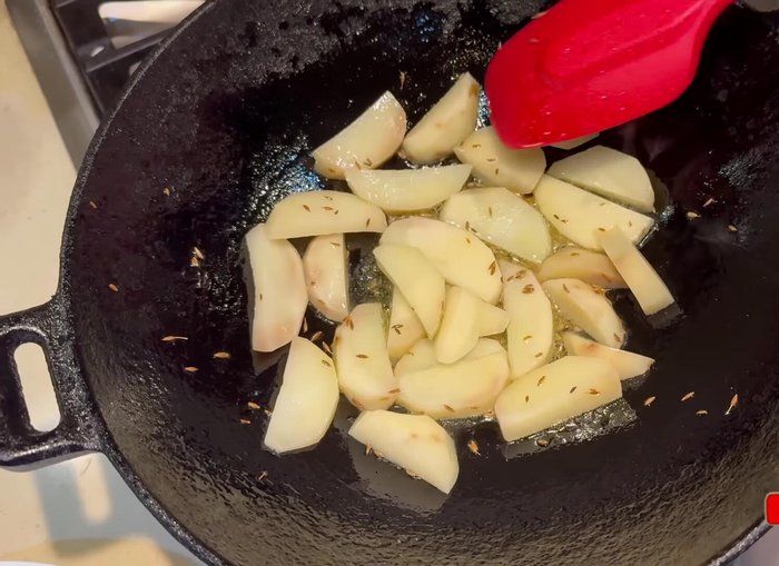 Add onions to the potatoes and continue frying until onions are lightly browned and potatoes are almost fully cooked (600.8).