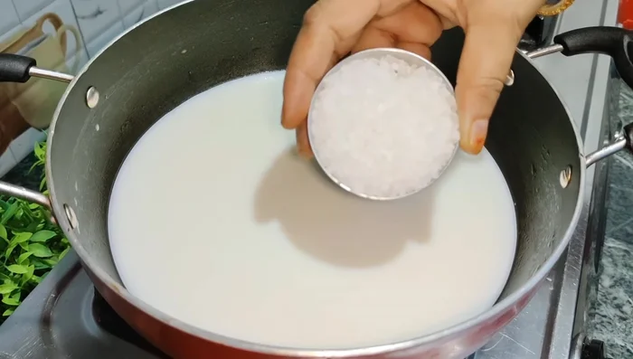 Add sugar to the boiling milk and stir until dissolved.