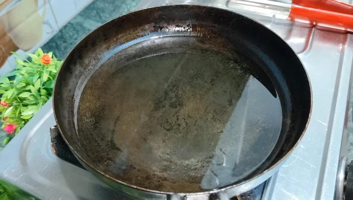 Lightly fry the bread pieces in oil until slightly colored. Do not over-fry.