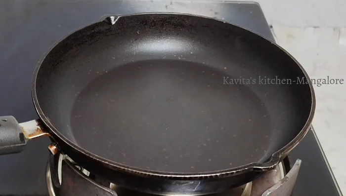 Heat a pan and add oil. Once hot, pour a ladle of batter and spread thinly.