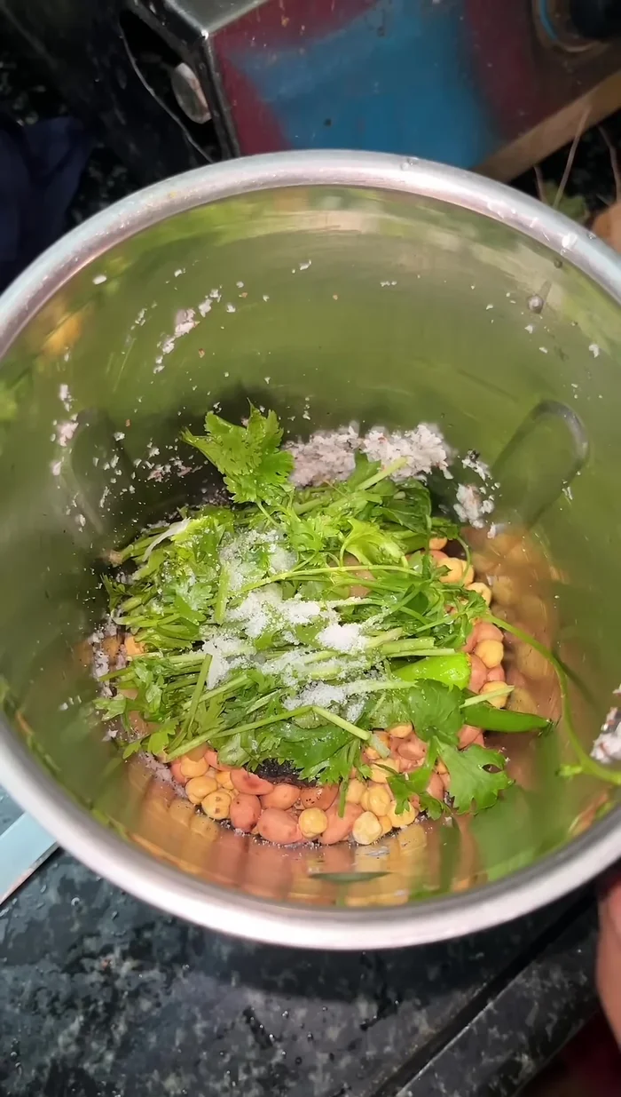Add salt and water to the mixer jar and blend until a smooth paste forms. Add more water if needed.