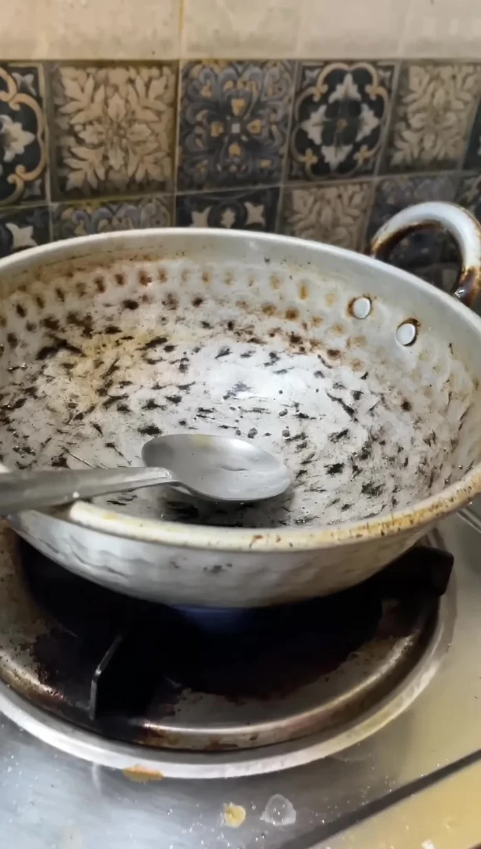 Turn the stove back on, bring the milk to a boil, and add oil.