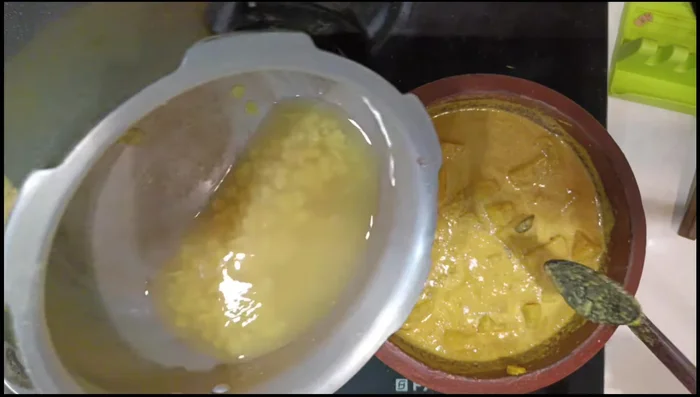 Add the cooked tuar dal and mix well. Boil once on low flame and switch off. (156.12)