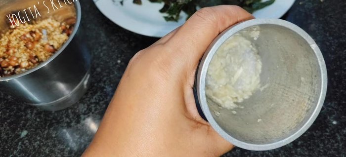 Crush garlic cloves to a coarse paste. Grate coconut if desired.