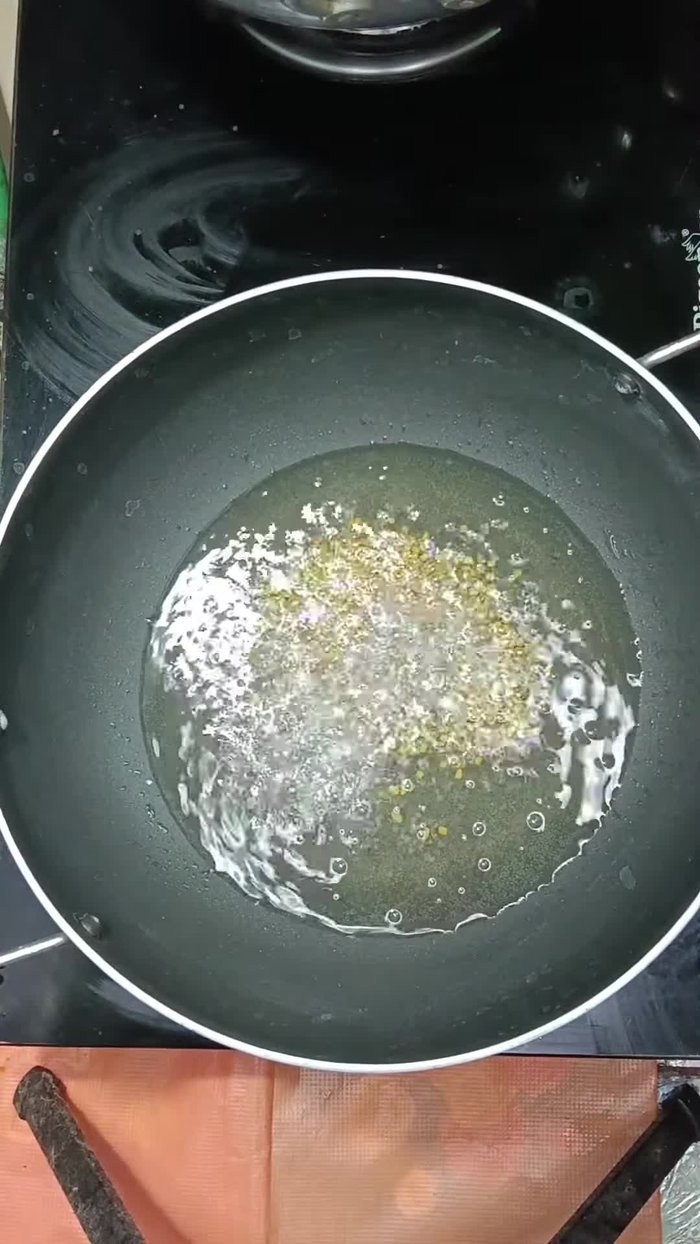 Add fenugreek seeds to the mustard seeds.