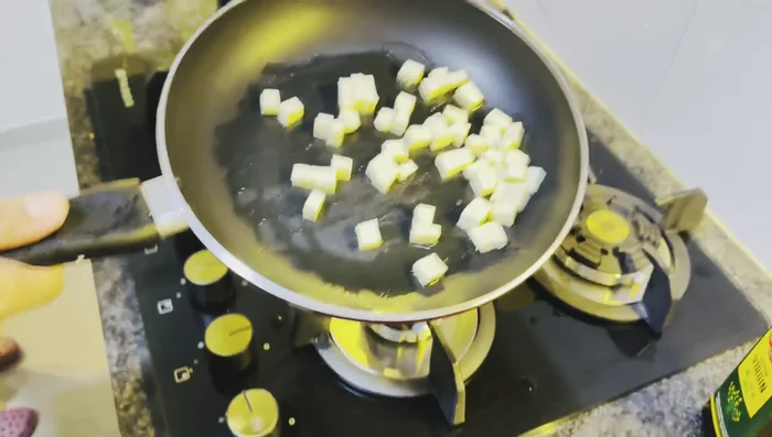 Add paneer to the pan and cook until lightly browned and slightly crusty, adding a little salt.