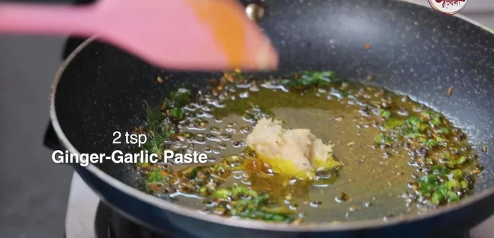 Add cumin seeds, asafoetida, turmeric powder, and ginger-garlic paste. Mix well.