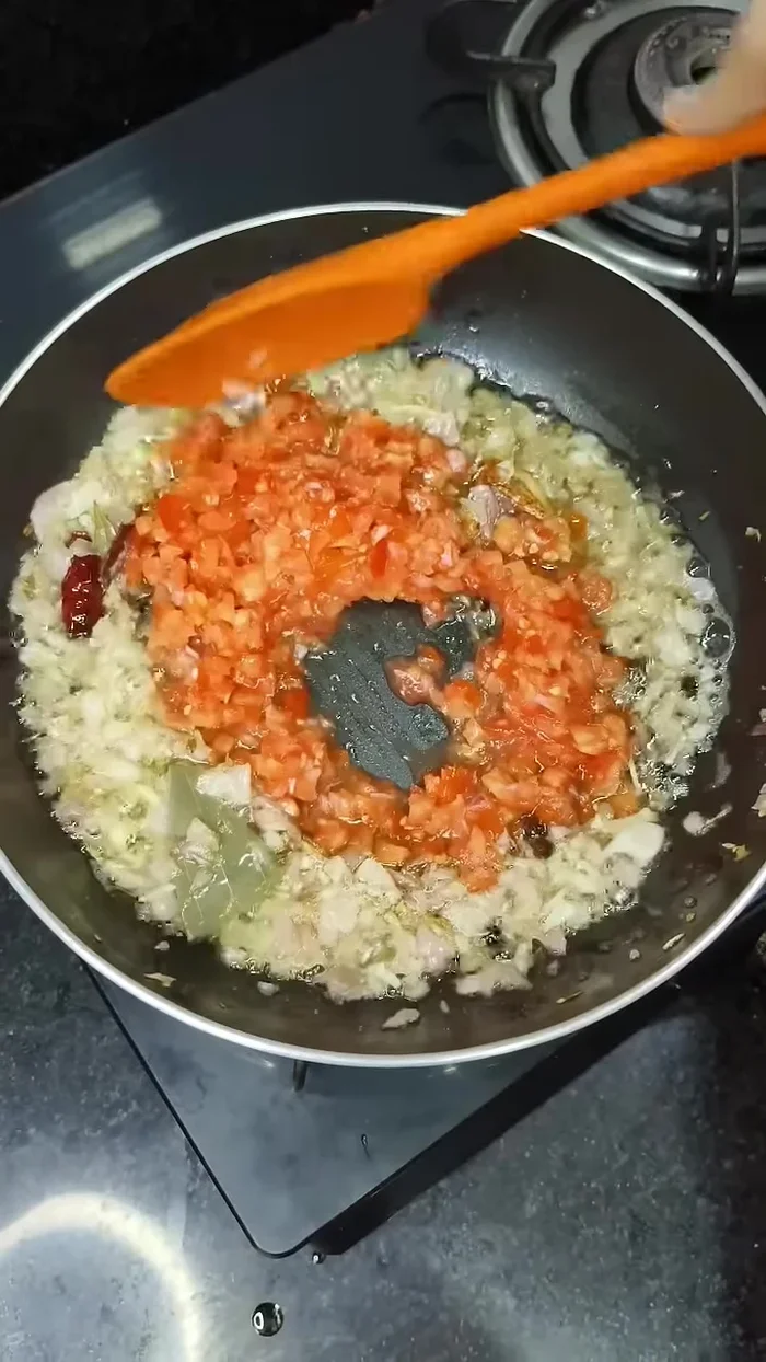 Add finely chopped tomatoes and cook until they melt.