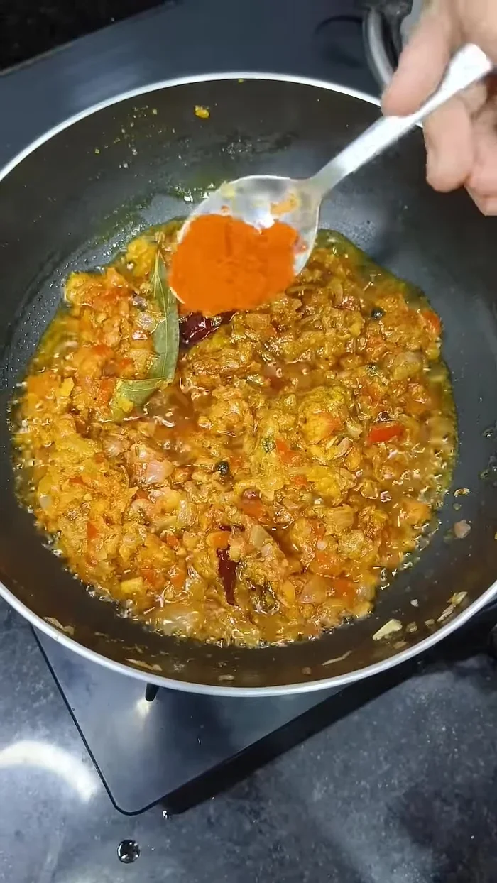 Add Kashmiri red chili powder and cook well.