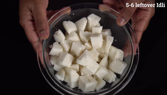 Cut the leftover idlis into small pieces.