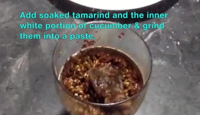Add the soaked tamarind and the white portion of cucumber to the mixie and grind it into a paste.