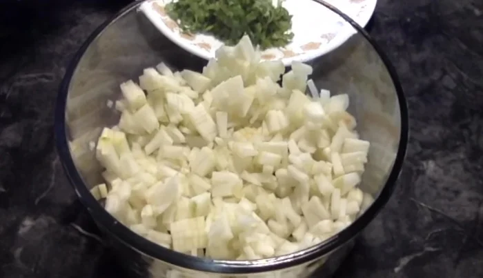 In a container, mix the cucumber pieces, turmeric powder, salt, and finely chopped cilantro.