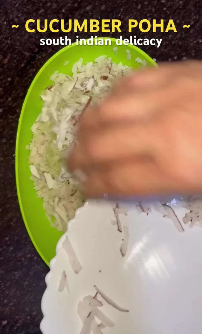 Mix the poha with grated cucumber and coconut.
