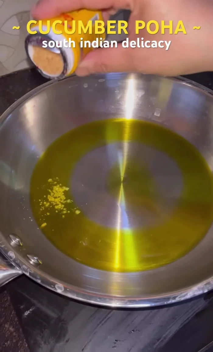 Prepare the seasoning: Heat mustard oil in a pan. Add asafoetida.