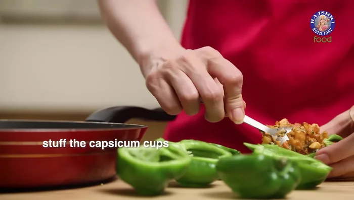 Fill the capsicum cups with the mixture, ensuring the filling is level with the top.