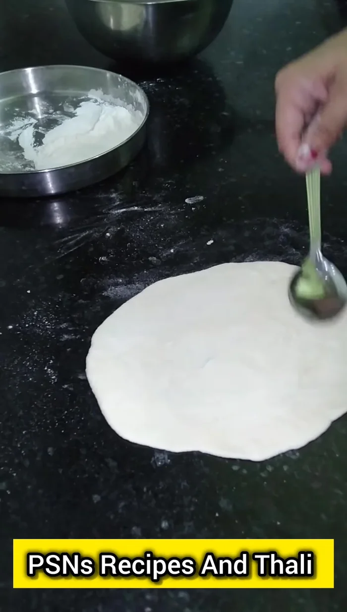 Lightly brush the rolled naan with water. (179.28)