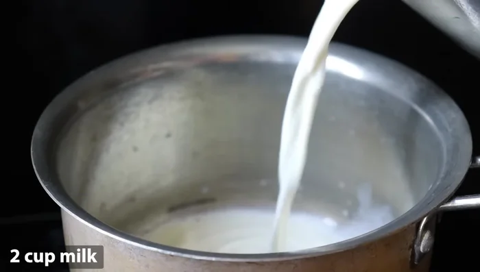Add 2 glasses of milk to a bowl and bring it to a boil.