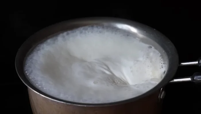 Add 2 teaspoons of sugar (or more/less to taste) to the boiling milk and mix well until dissolved.